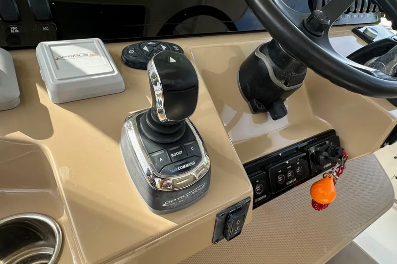  Yacht Photos Pics Control panel of 2019 Sailfish 360 CC boat with joystick and steering wheel.