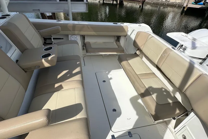  Yacht Photos Pics 2019 Sailfish 360 CC boat interior with beige seating and cup holders.