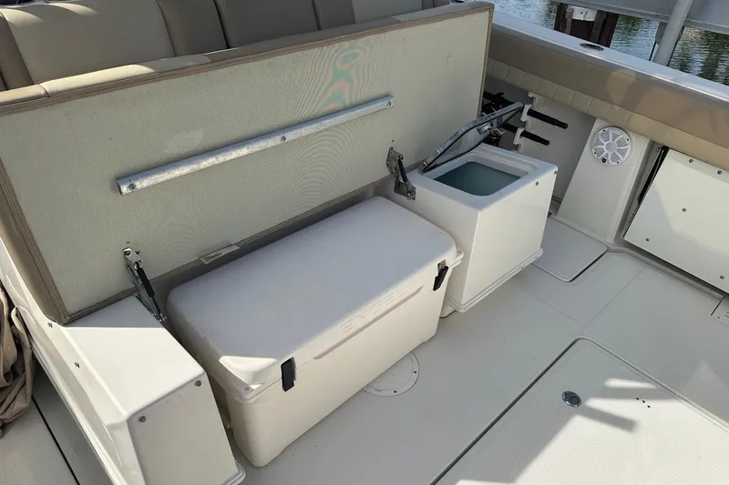  Yacht Photos Pics 2019 Sailfish 360 CC boat interior with storage and seating area.