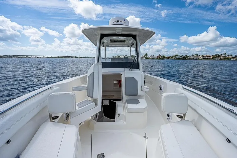  Yacht Photos Pics 2021 Pursuit S 288 Sport boat interior with seating, on a sunny day at sea.