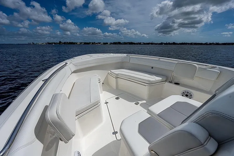  Yacht Photos Pics 2021 Pursuit S 288 Sport boat interior with seating, on a sunny day.