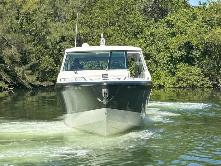 Aseage Yacht Photos Pics 2022 Formula 380 Super Sport Crossover OB cruising on a calm river.