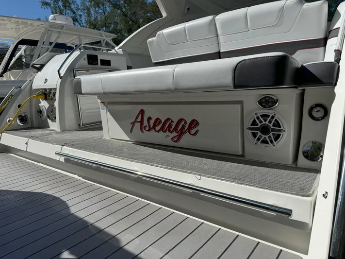 Aseage Yacht Photos Pics 2022 Formula 380 Super Sport Crossover OB boat with cushioned seating and speaker system.