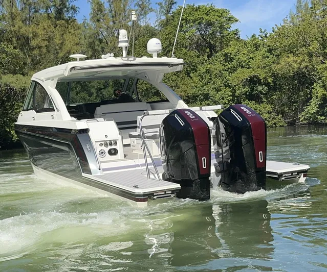 Aseage Yacht Photos Pics 2022 Formula 380 Super Sport Crossover OB cruising on a calm waterway.