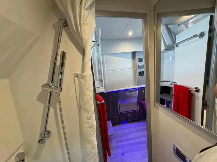 Aseage Yacht Photos Pics Interior of 2022 Formula 380 Super Sport Crossover OB, featuring modern bathroom and cabin area.
