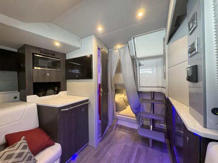 Aseage Yacht Photos Pics Interior of 2022 Formula 380 Super Sport Crossover OB, featuring modern amenities and cozy sleeping area.