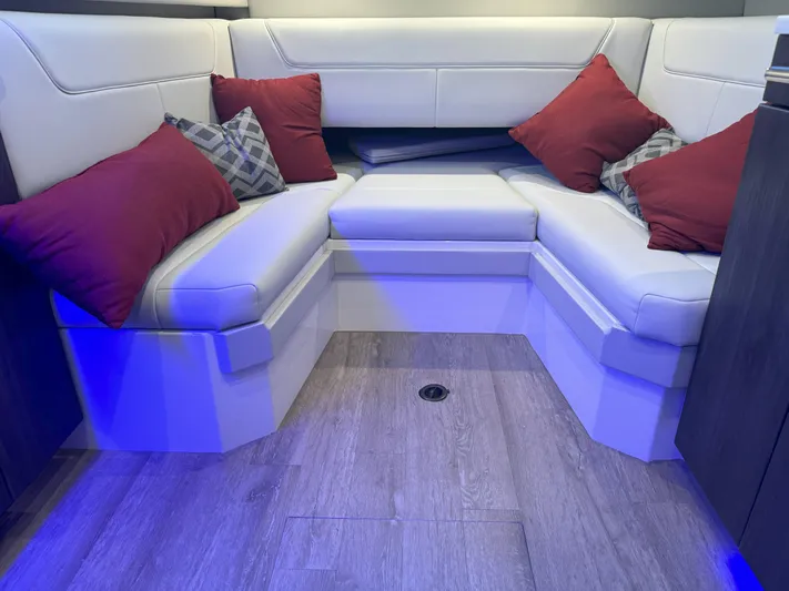 Aseage Yacht Photos Pics 2022 Formula 380 Super Sport Crossover OB interior with white seating and red cushions.