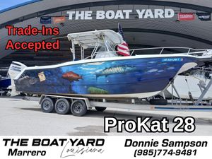 2002 ProKat 2860 Center Console boat with ocean-themed wrap at The Boat Yard, Marrero.