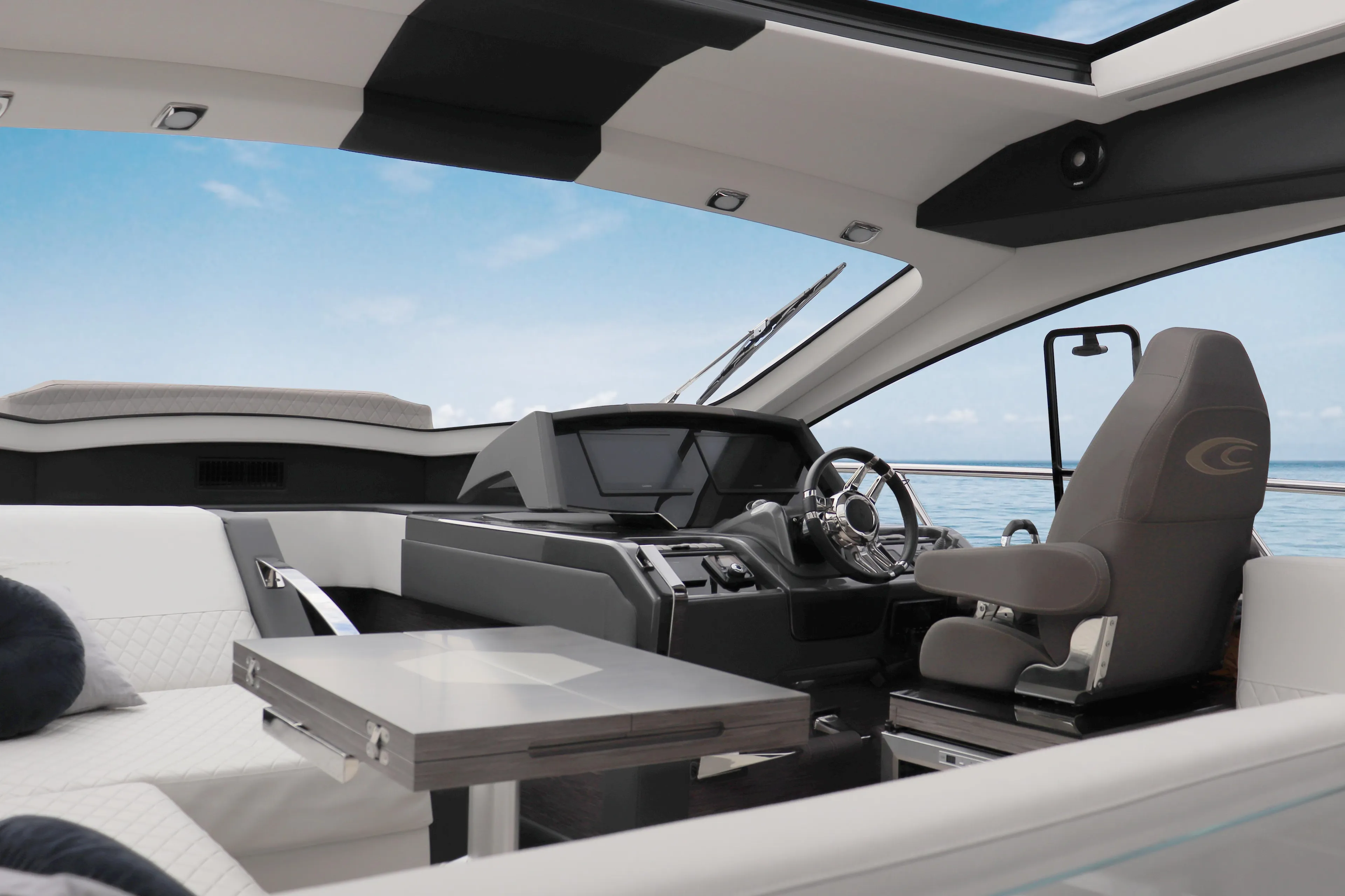 Luxurious interior of 2025 Cobrey 45 FLY yacht with modern helm and seating.