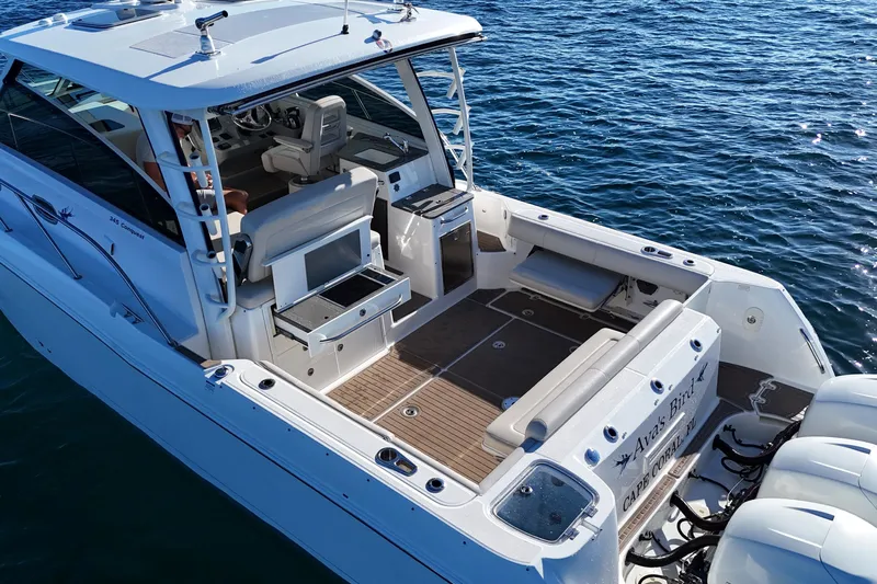 Whaler 345 Conquest - Loaded Yacht Photos Pics 2016 Boston Whaler 345 Conquest boat on water, featuring spacious deck and seating.