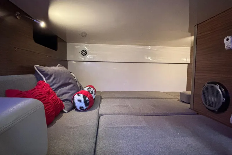 Whaler 345 Conquest - Loaded Yacht Photos Pics Interior cabin of 2016 Boston Whaler 345 Conquest with cozy seating and decorative pillows.