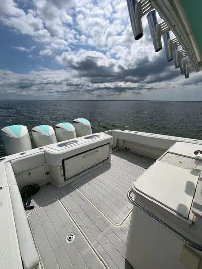  Yacht Photos Pics 2019 HCB Siesta boat deck with ocean view and cloudy sky.