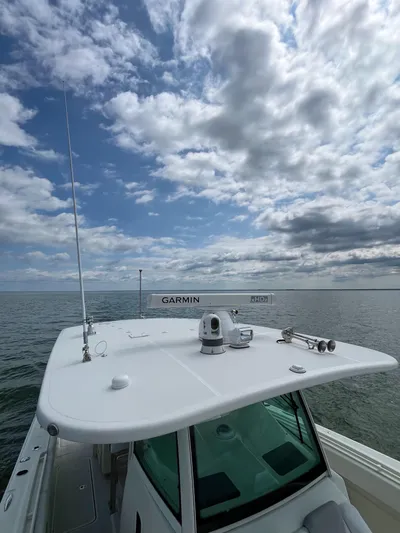  Yacht Photos Pics 2019 HCB Siesta boat with Garmin equipment on open water under cloudy sky.