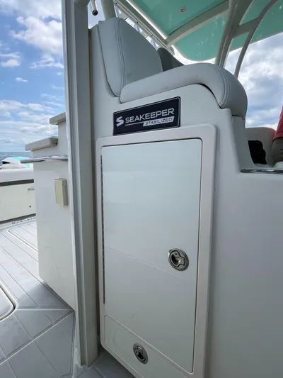  Yacht Photos Pics 2019 HCB Siesta boat interior with Seakeeper system, featuring sleek seating and storage.