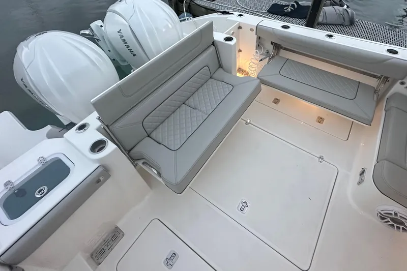  Yacht Photos Pics 2023 Pursuit DC 326 Dual Console boat interior with seating and Yamaha engines.