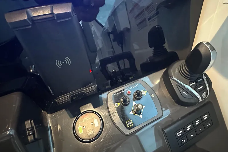  Yacht Photos Pics Control panel of 2023 Pursuit DC 326 Dual Console with joystick and searchlight controls.