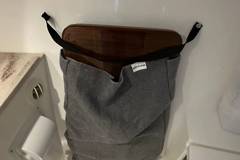  Yacht Photos Pics Storage pocket with wooden board on 2023 Pursuit DC 326 Dual Console boat.