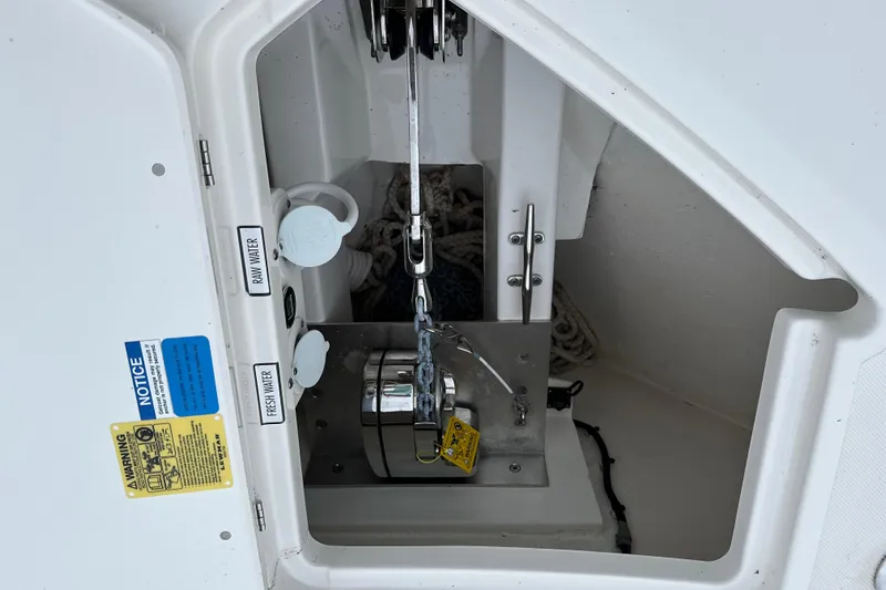  Yacht Photos Pics Anchor compartment of 2023 Pursuit DC 326 Dual Console boat with water access controls.