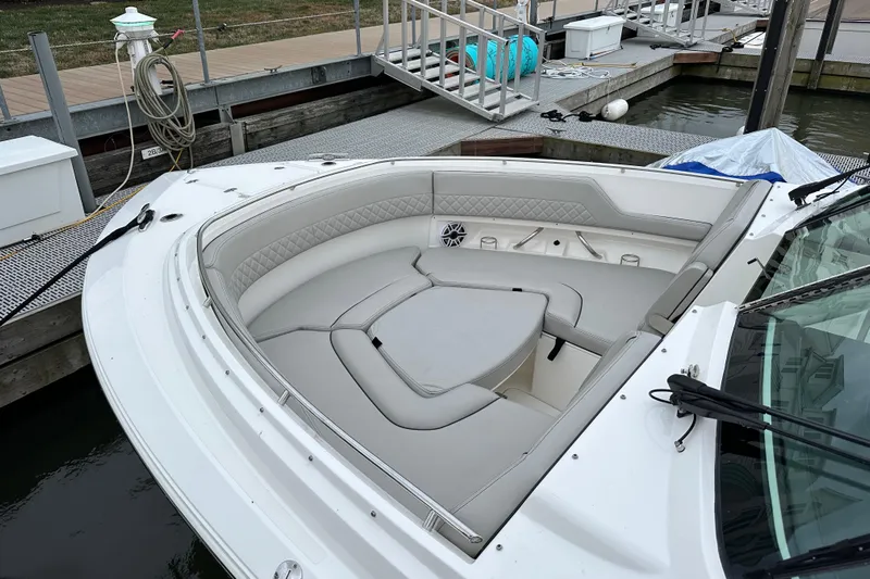  Yacht Photos Pics 2023 Pursuit DC 326 Dual Console boat with spacious seating at dock.