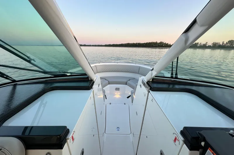  Yacht Photos Pics 2023 Pursuit DC 326 Dual Console boat interior with serene water view.