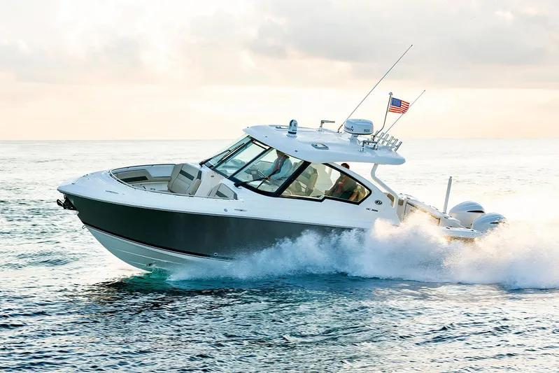First Mate Yacht Photos Pics Manufacturer Provided Image: 2020 Pursuit DC 326 Dual Console boat cruising on open water.