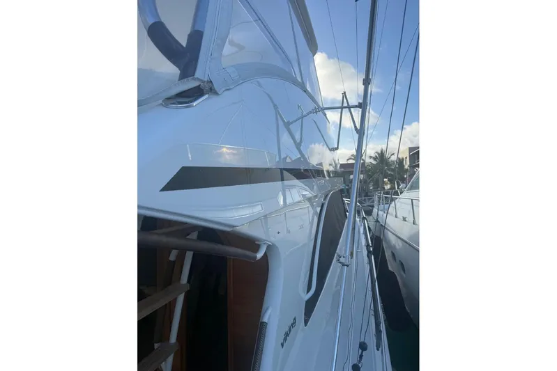 Spey Yacht Photos Pics 2010 Viking 57 Convertible yacht docked, showcasing sleek design and polished exterior.