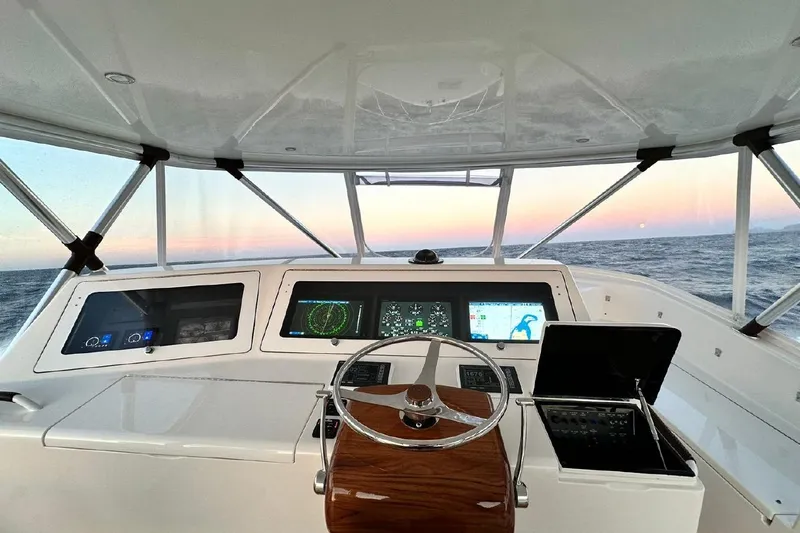 Spey Yacht Photos Pics Interior view of 2010 Viking 57 Convertible yacht cockpit at sunset.