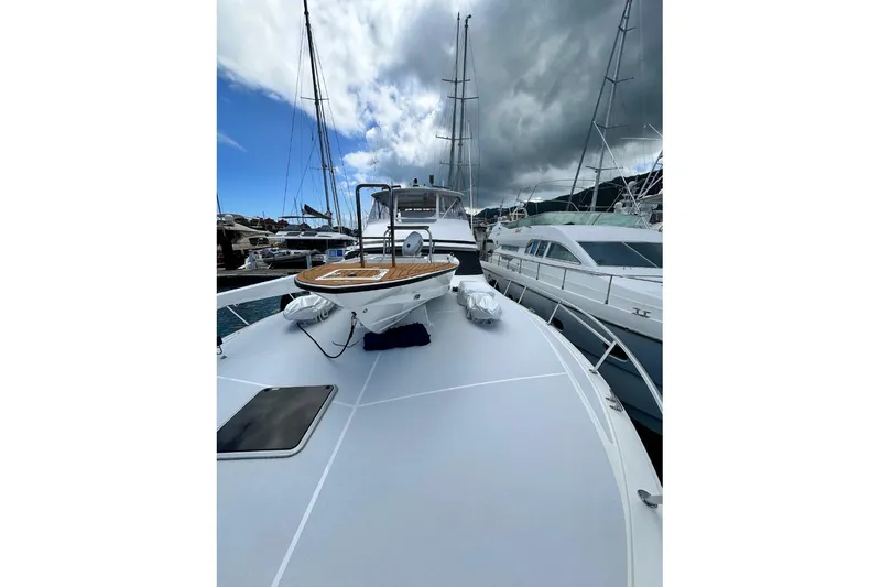 Spey Yacht Photos Pics 2010 Viking 57 Convertible yacht docked at marina under cloudy sky.