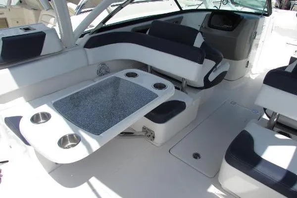 317-147 Brokerage Ray Yacht Photos Pics 2018 Robalo R317 Dual Console boat interior with seating and table setup.