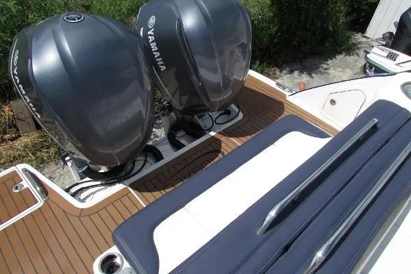 317-147 Brokerage Ray Yacht Photos Pics 2018 Robalo R317 Dual Console with twin Yamaha outboard engines on teak deck.