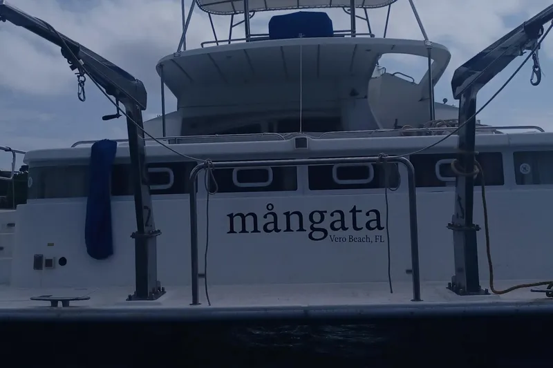 Mangata Yacht Photos Pics 2003 Lagoon Power 43 yacht, named "M&aring;ngata," docked in Vero Beach, FL.