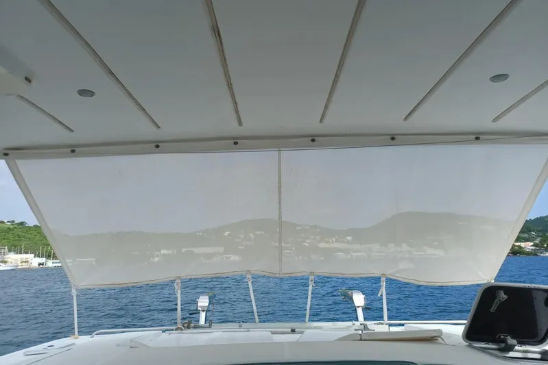 Mangata Yacht Photos Pics View from Lagoon Power 43 yacht, 2003 model, overlooking serene blue waters and distant hills.