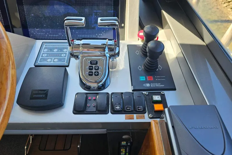 Gramac V Yacht Photos Pics Control panel of a 2007 Azzura 76 yacht with throttle and navigation controls.