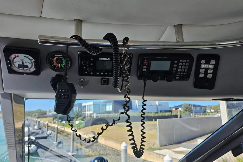 Gramac V Yacht Photos Pics Control panel of a 2007 Azzura 76 boat with navigation and communication equipment.