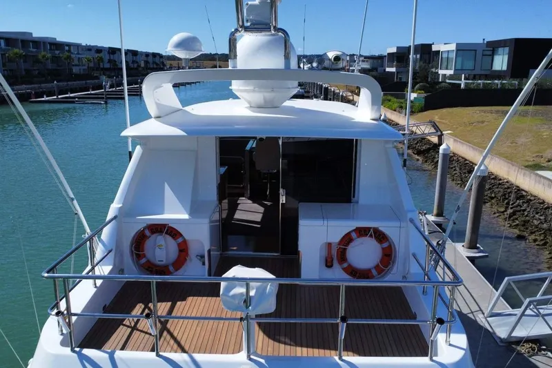 Gramac V Yacht Photos Pics Luxury Azzura 76 yacht docked, showcasing sleek design and spacious deck, 2007 model.