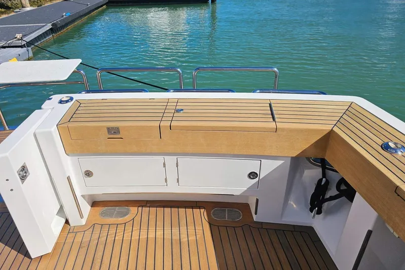 Gramac V Yacht Photos Pics Azzura 76 yacht deck, 2007 model, featuring wooden cabinetry and scenic water view.