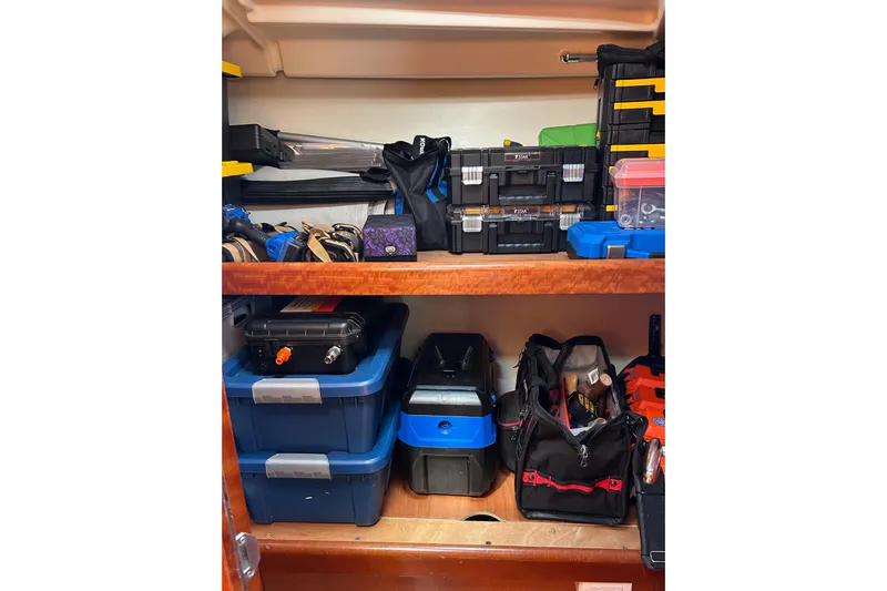 Banyan Sea Yacht Photos Pics Storage area on a 2008 Beneteau Oceanis 43 yacht with organized tools and equipment.