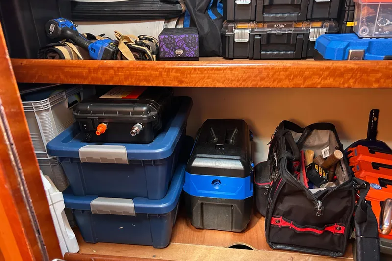 Banyan Sea Yacht Photos Pics Storage area on a 2008 Beneteau Oceanis 43 yacht with tools and equipment.