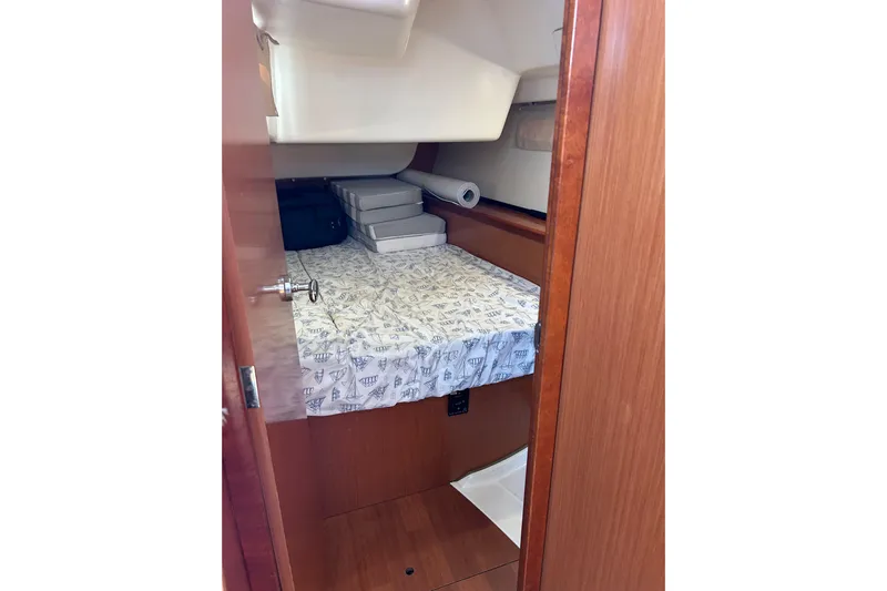 Banyan Sea Yacht Photos Pics Interior cabin of 2008 Beneteau Oceanis 43 sailboat with storage and bedding.