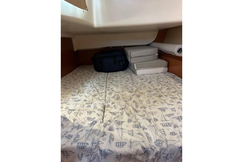Banyan Sea Yacht Photos Pics Cozy cabin interior of 2008 Beneteau Oceanis 43 sailboat with patterned bedding.