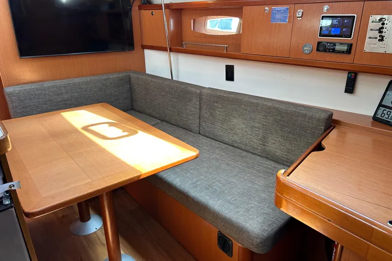 Banyan Sea Yacht Photos Pics Interior of 2008 Beneteau Oceanis 43 yacht with cozy seating and wooden table.