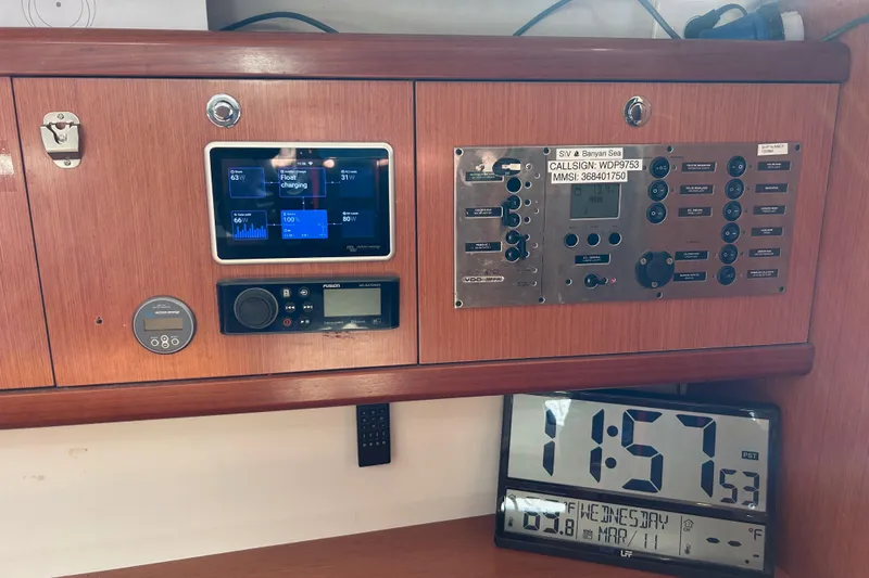 Banyan Sea Yacht Photos Pics Control panel of a 2008 Beneteau Oceanis 43 sailboat with electronic displays and clock.