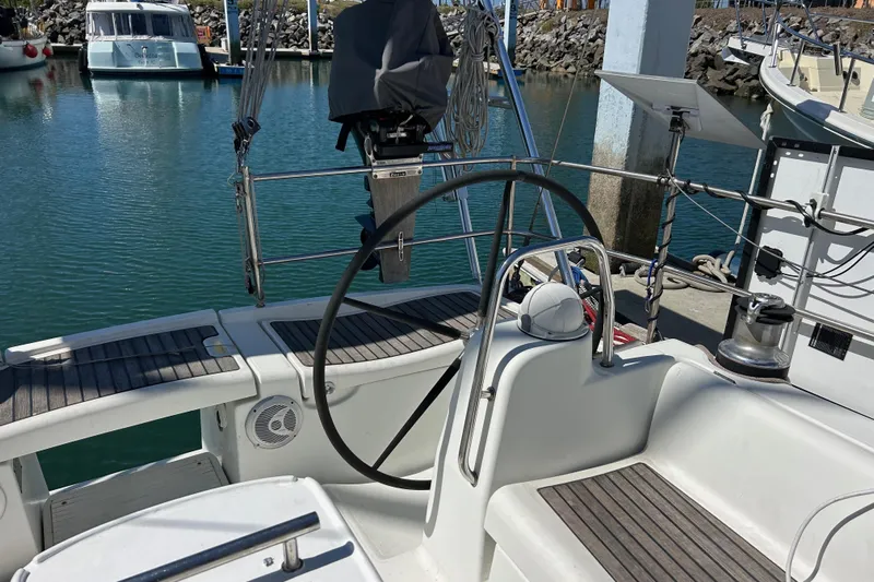 Banyan Sea Yacht Photos Pics Cockpit of a 2008 Beneteau Oceanis 43 sailboat docked at a marina.