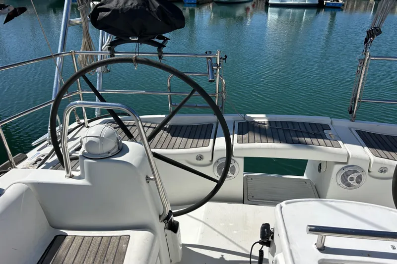 Banyan Sea Yacht Photos Pics Cockpit of 2008 Beneteau Oceanis 43 sailboat with steering wheel and seating.