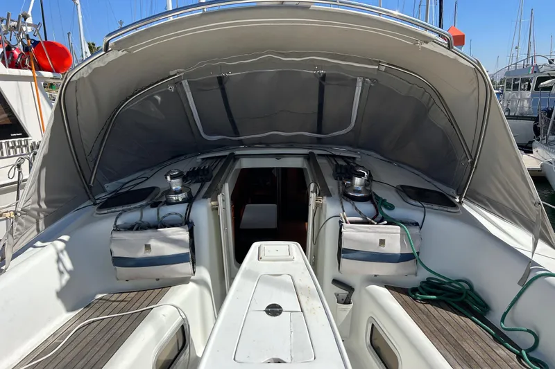 Banyan Sea Yacht Photos Pics 2008 Beneteau Oceanis 43 sailboat cockpit with canopy, docked at marina.