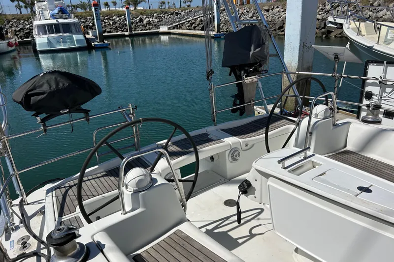Banyan Sea Yacht Photos Pics Cockpit view of a 2008 Beneteau Oceanis 43 yacht docked in a marina.