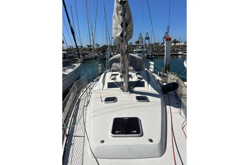 Banyan Sea Yacht Photos Pics 2008 Beneteau Oceanis 43 sailboat docked in a marina under clear blue skies.