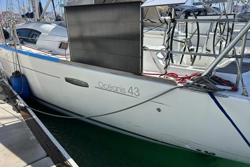 Banyan Sea Yacht Photos Pics 2008 Beneteau Oceanis 43 yacht docked at marina, side view with visible deck details.