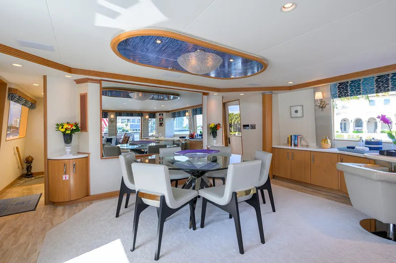Hard Times Yacht Photos Pics Luxurious interior of 1998 Westport Westbay Sonship yacht with elegant dining area and modern decor.