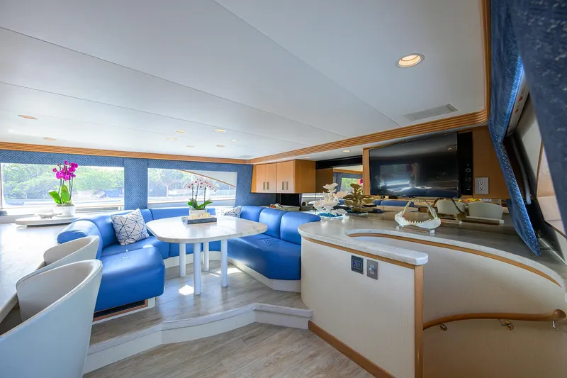 Hard Times Yacht Photos Pics Luxurious 1998 Westport Westbay Sonship yacht interior with blue seating and modern decor.